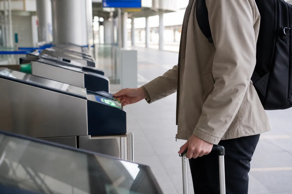 foreign traveler using korail pass plus for KTX boarding at a station